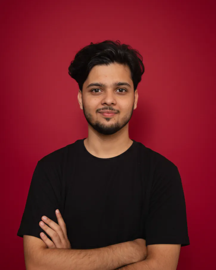 Rafe Mirza, founder of AgentBlue, in a black T-shirt against a red background.